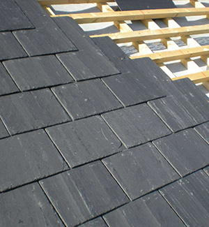 Part way through a slate roof in Wirral