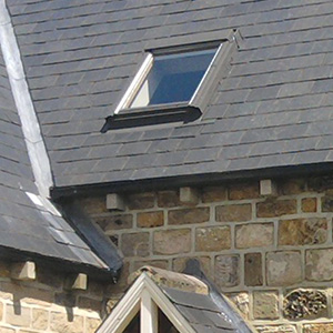 Velux window in slate roof